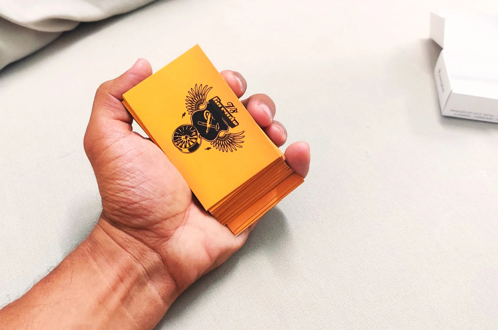 The printed cards, held at their real scale