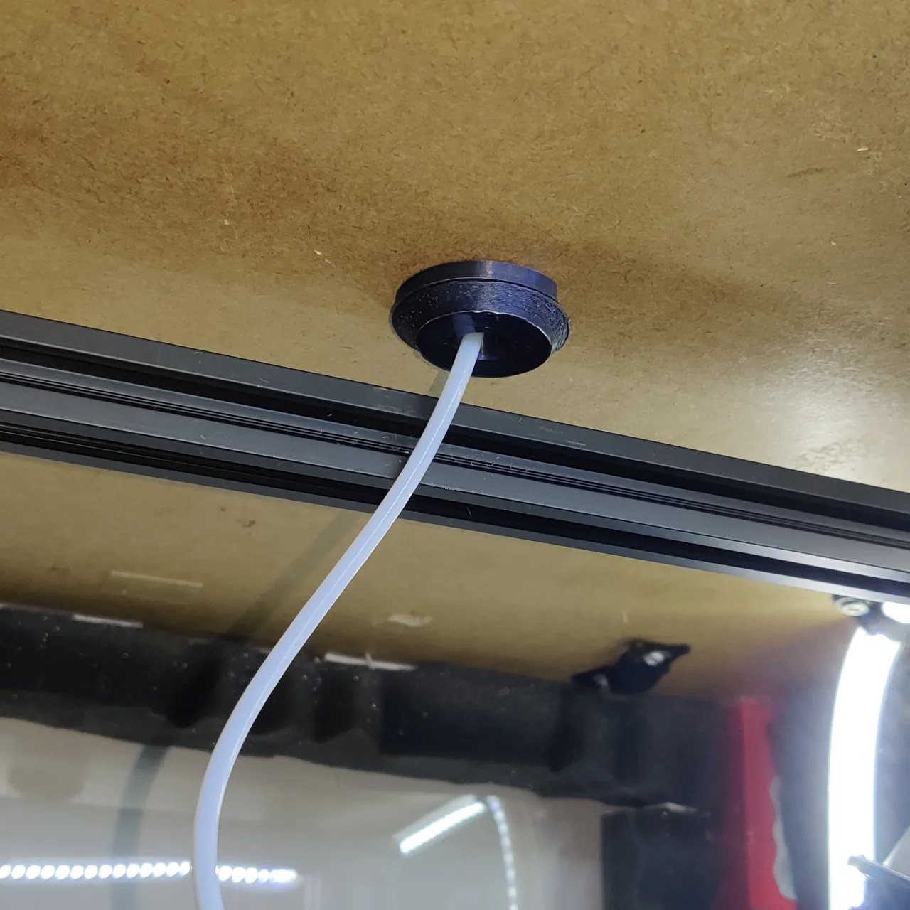 Filament guide and dust cover seen from inside an IKEA Lack enclosure