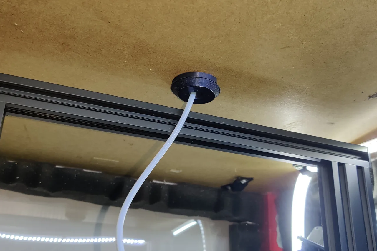 Filament guide and dust cover seen from inside an IKEA Lack enclosure
