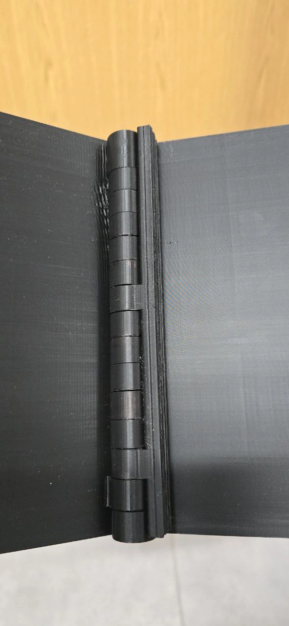 Original prototype — the 3D-printed hinge binding