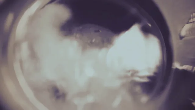 A laboratory flask, close up, with cloudy liquid