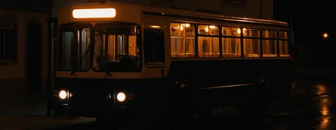The Linha 00 bus waiting in the rain at night
